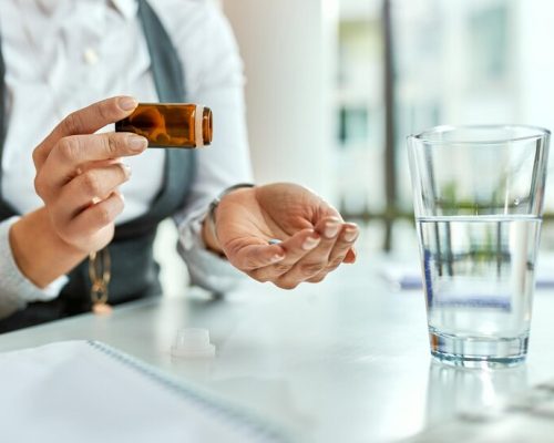 closeup-unrecognizable-businesswoman-talking-pills-office_637285-4666 closeup-unrecognizable-businesswoman-talking-pills-office_637285-4666